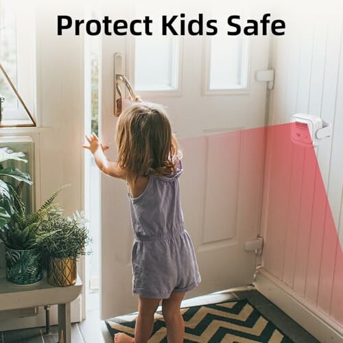 Child reaching for door with safety sensor installed.