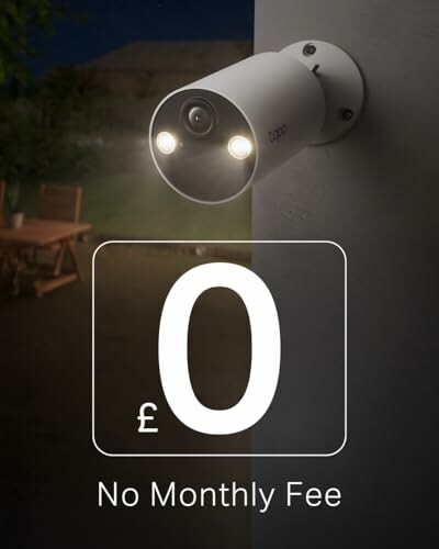 Outdoor security camera mounted on a wall at night with text '£0 No Monthly Fee'.