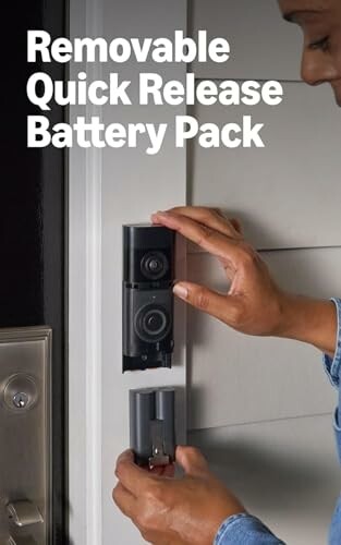 Person changing a removable quick release battery pack in a doorbell.