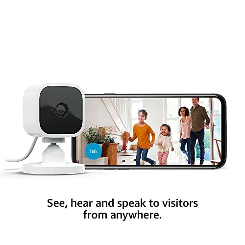 Smart home security camera with smartphone showing family video.